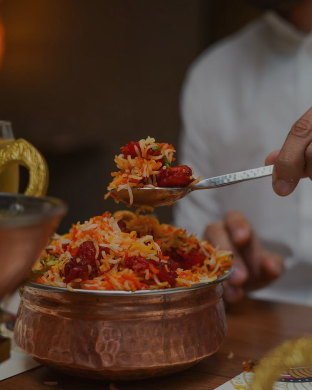 Hyderabadi biryani lifted fresh from the copper pot